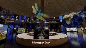 Interior of the Virtual Peatlands Pavilion, showing the information desk with a giant dragonfly and globe suspended above it.